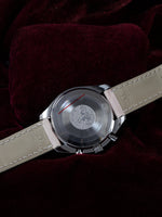 Omega Speedmaster Automatic Chronograph 38mm Ref. 3834.74.34 – caseback view showing OMEGA engravings and movement details, pink leather strap