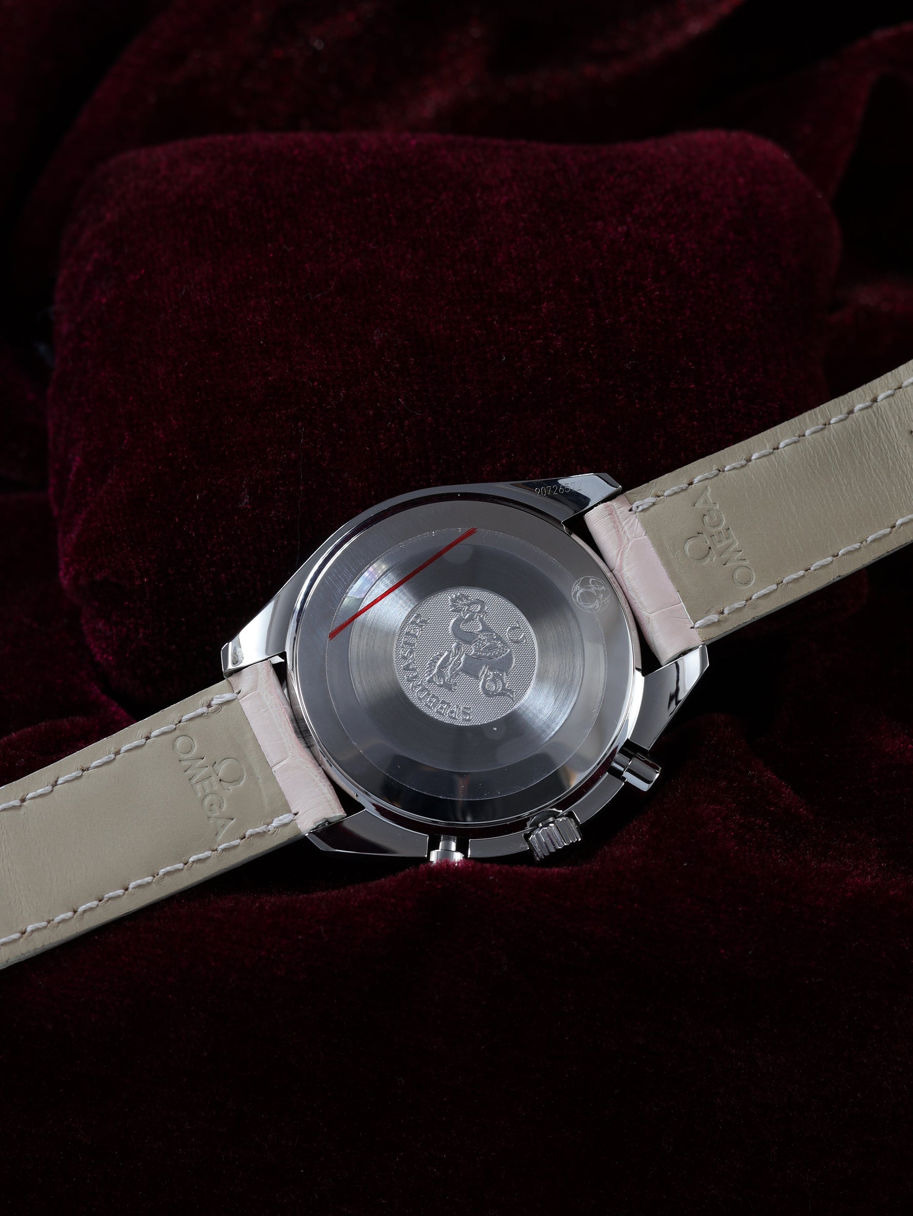 Omega Speedmaster Automatic Chronograph 38mm Ref. 3834.74.34 – caseback view showing OMEGA engravings and movement details, pink leather strap