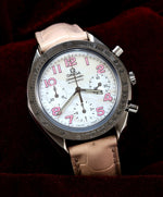 Omega Speedmaster Automatic Chronograph 38mm Ref. 3834.74.34 – front view, white mother-of-pearl dial, pink Arabic numerals, pink leather strap