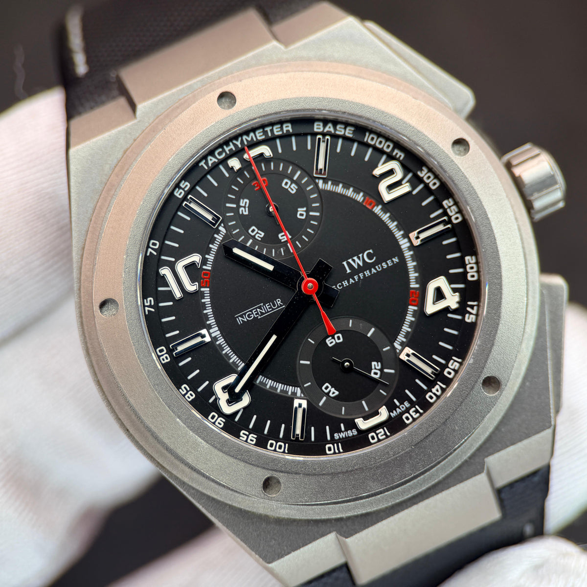 IWC Ingenieur Chronograph AMG Ref. IW372504 in titanium with a black dial, red chronograph hands and a tachymeter bezel